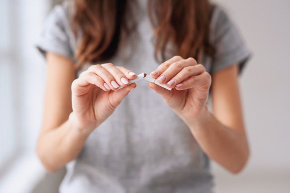 Women Breaking Cigarette