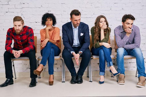 Group of depressed people sitting on a chair