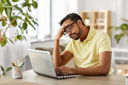 Depressed man with computer