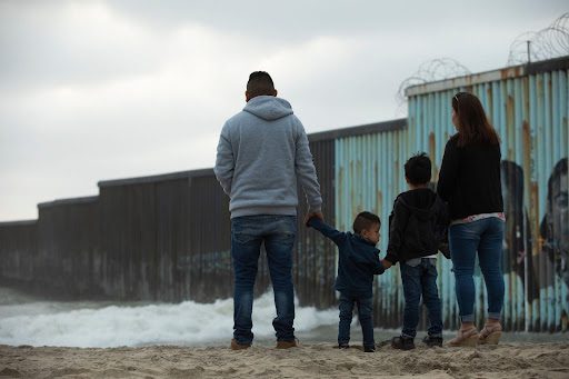 refugees family holding hands