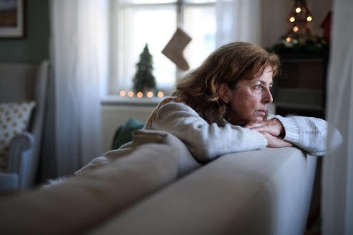 Sad Woman sitting on a coach