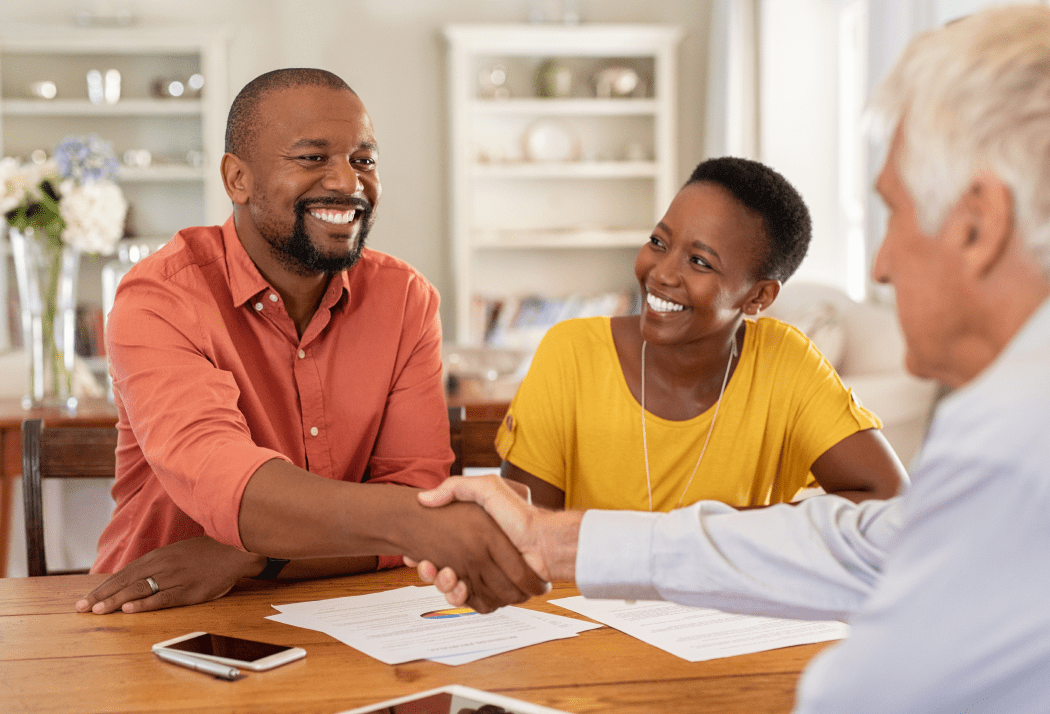 Man shaking hands with insurance agent